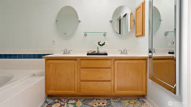The full-length mirror stays for everyday convenience, while the primary bath offers a dual vanity soaking tub, perfect for unwinding at the end of the day.