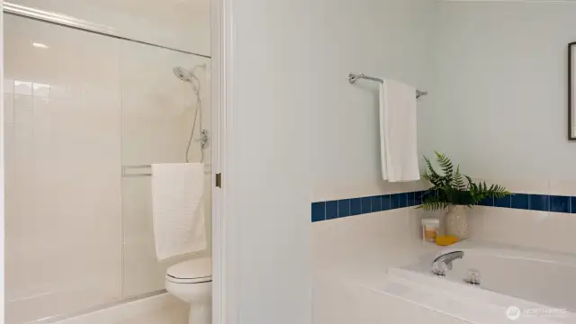 A full-size step-in shower adds both comfort and convenience to this five-piece primary ensuite.