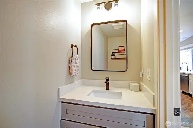 Powder room off the kitchen is perfect for when you are entertaining guests.