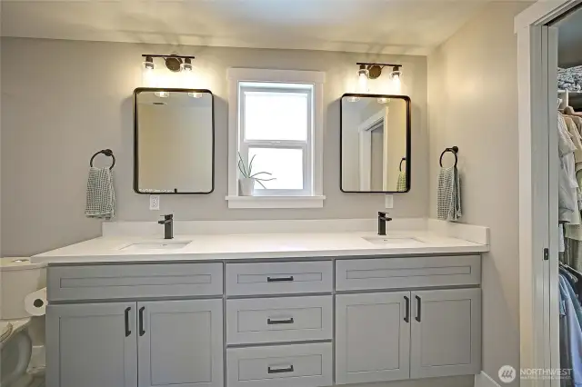 Double vanities and ample storage round out this amazing primary bathroom.