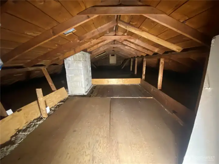 Large storage area in attic connected to loft.