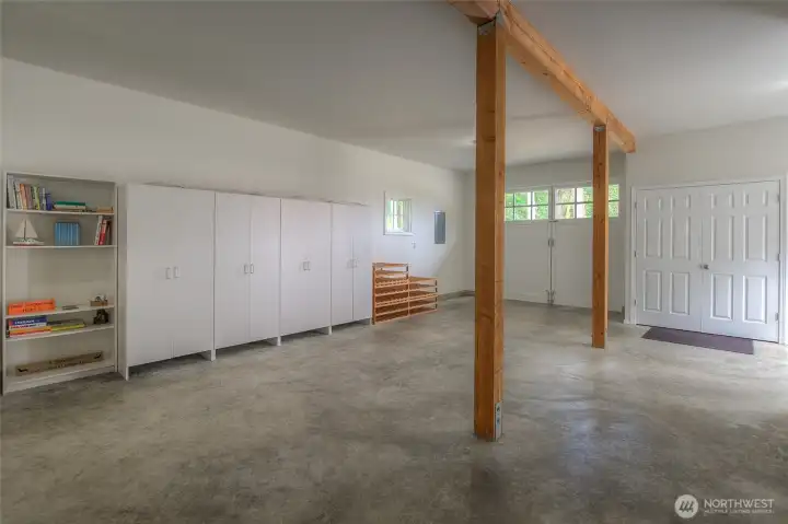Two-car garage and workshop with bathroom below guest house.