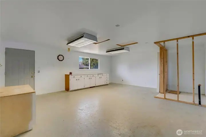 A detached shop with built-in workshop space & plumbed for bathroom.