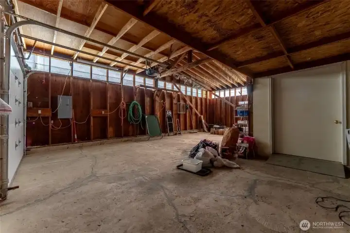 Insulated storage room off garage.  Perfect for all your extras- could be a great art studio or creative space.