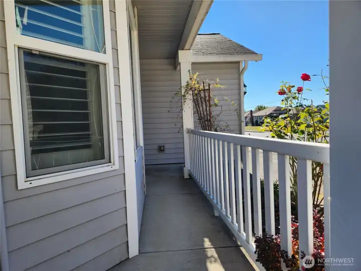 Cozy front porch, room for a small chair to enjoy your morning coffee!