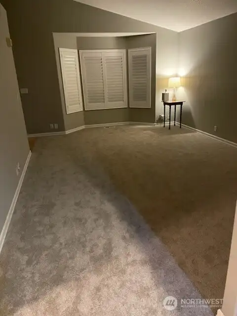 Another view of new carpet install - living room / bay window