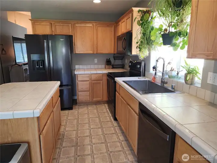 Kitchen has recessed light to provide even more light, as well as the kitchen window which lets plenty of light in the space.