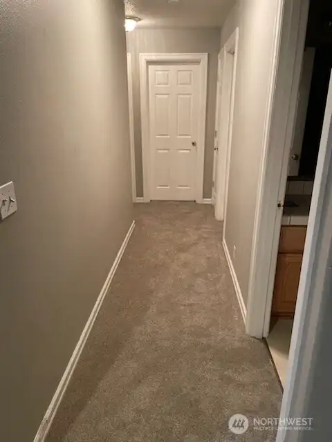 Hallway to bedrooms, guest bath, utility room/garage - new carpet installed 1/5/26
