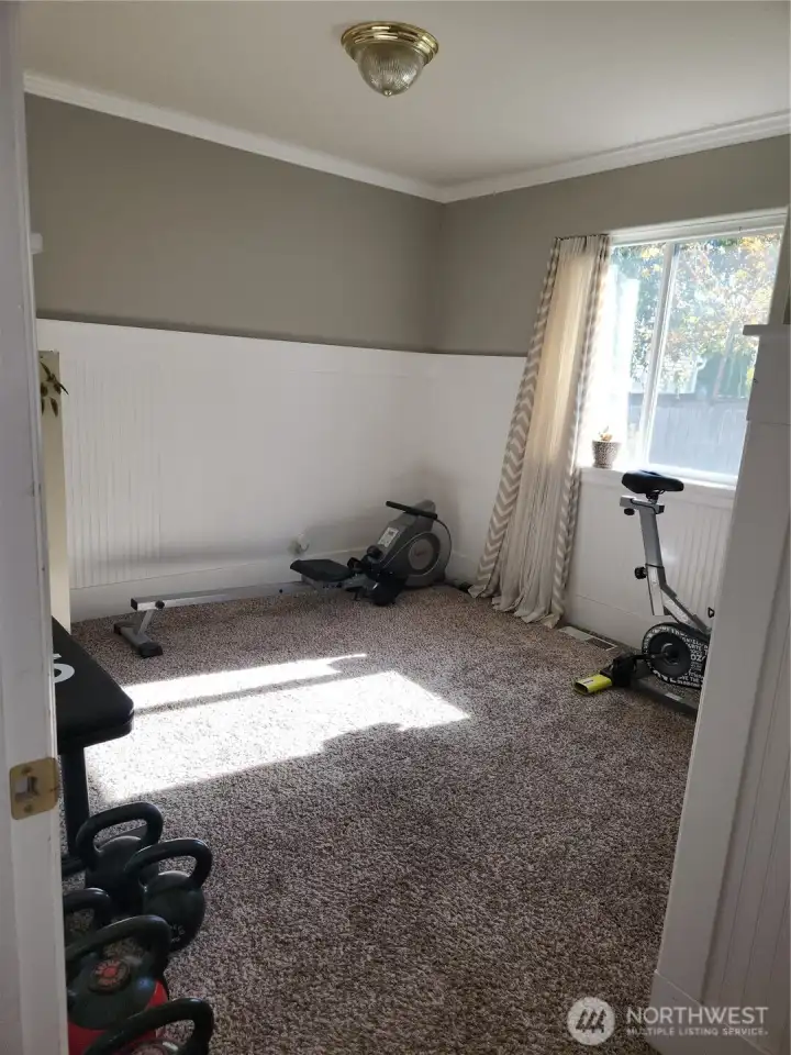 Guest room 2, currently being utilized as a workout room
