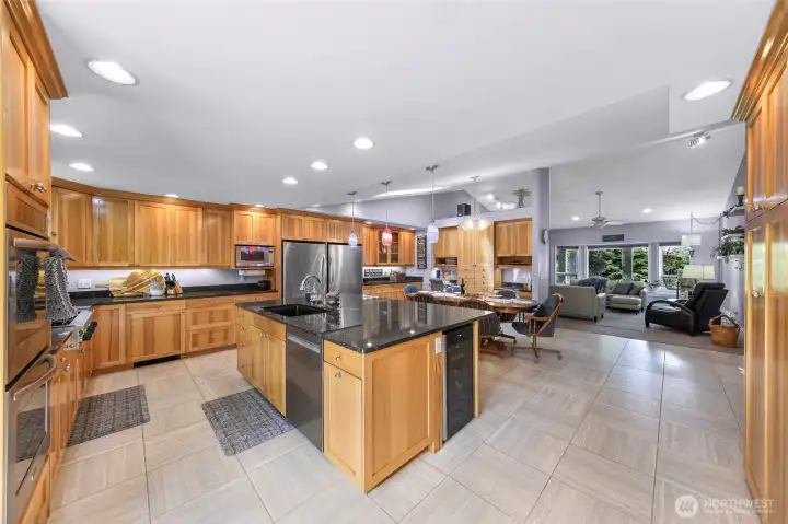 HUGE kitchen, large island, cabinets wrap around kitchen, dining area, and pantry wall.