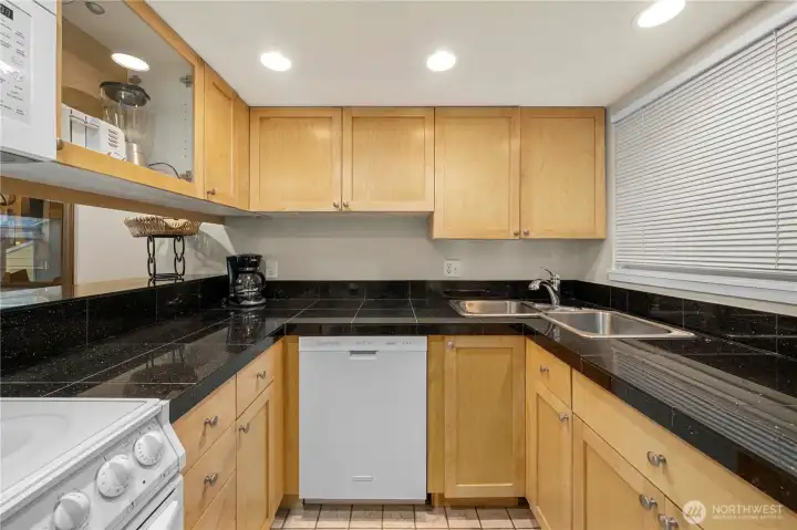 Remodeled kitchen with granite counters.