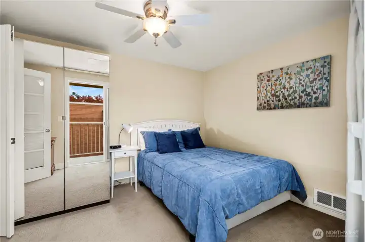 2nd bedroom with slider opening to deck.