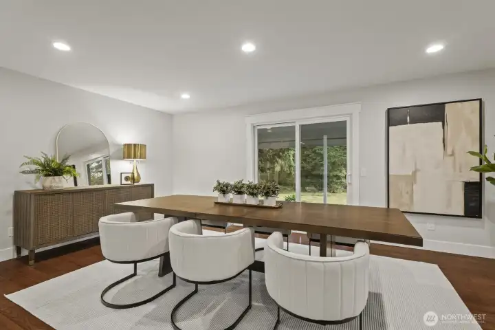 Large dinning room with access to the back yard and library