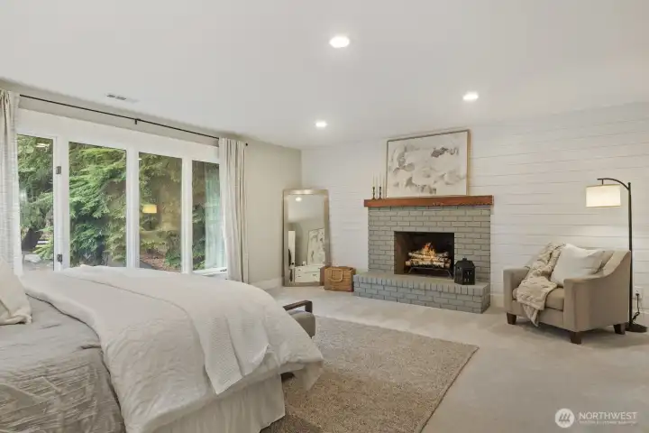 Large primary bedroom with wood burning fireplace
