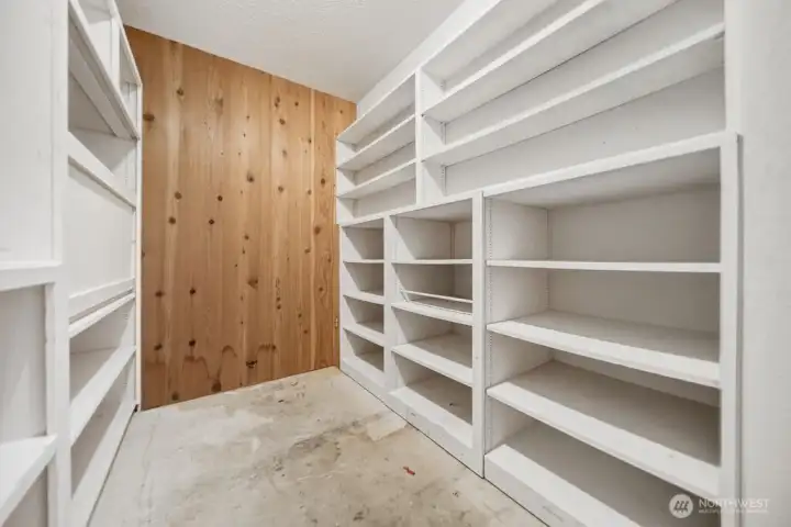 Downstairs storage & hidden room with safe