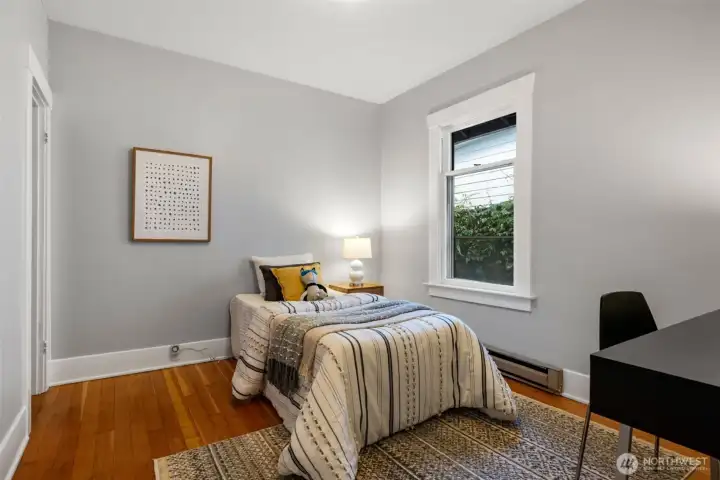 Main floor bedroom with fir floors.