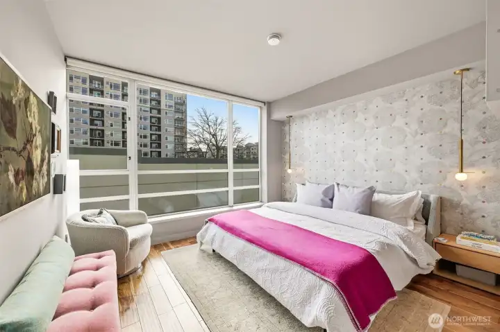 Sanctuary primary suite with imported wallpaper and curated lighting.