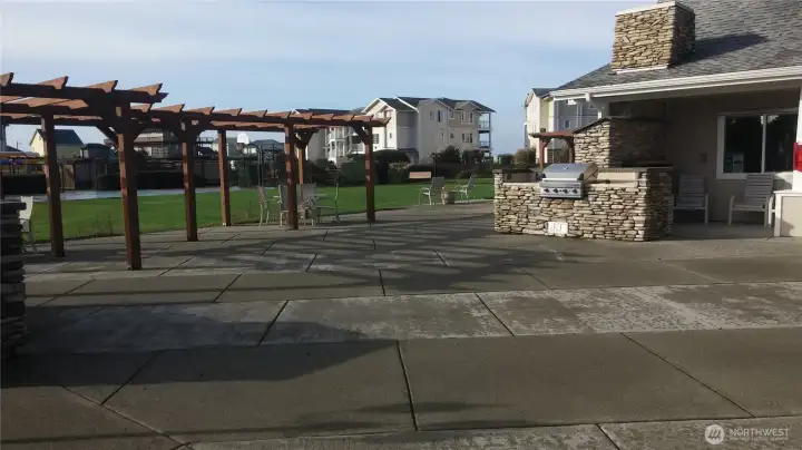 Patio area with BBQ's and a gas fireplace