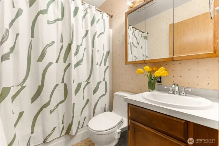 Bath and kitchen floors tiled to match. Unique 3 size pattern.