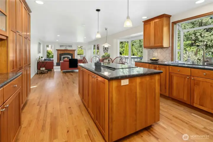 Warm wood cabinetry, granite counters, and enough prep space that two cooks won't get in each other's way — finally