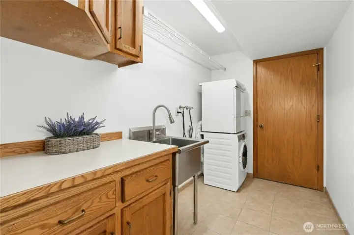 A dedicated laundry room with real space to fold — the detail that sounds small until you've lived without it