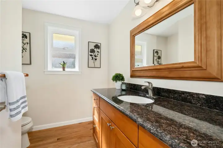 Granite in the bath isn't just a luxury — it means this home was finished with consistency throughout, not just in the rooms people see first