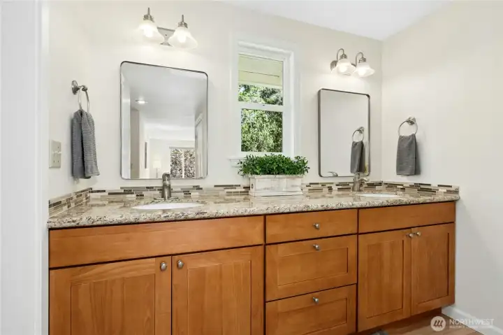 The primary bath vanity is wider than it looks in photos — double sinks, real counter space, no morning negotiations