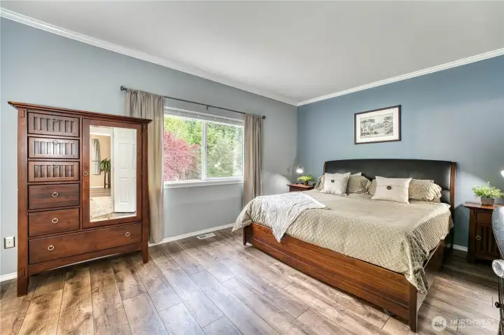 Primanry bedroom located at the back of the home for privacy with updated laminate flooring.