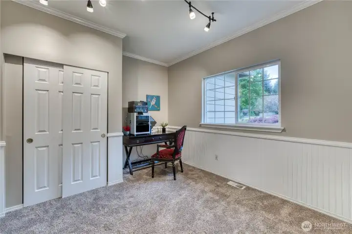 Bedroom #3 with beadboard wainscotting.