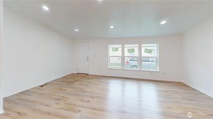 The home has been remodeled and shows like NEW. The spacious great room features vaulted ceiling, coat closet off the entry, new windows, new paint and opens to the dining room and kitchen.