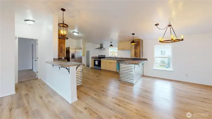 Your dream kitchen is here! New stainless appliances, tons of cabinet and counter space, tile work, display cabinet, laminate wood flooring, display shelves - it's all here!