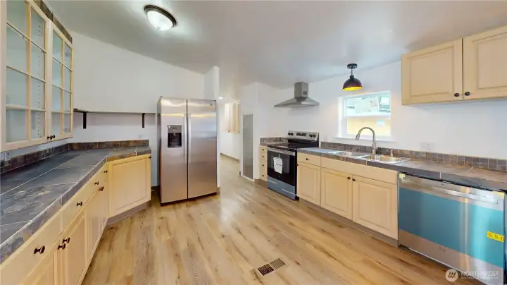 Additional view of the kitchen.