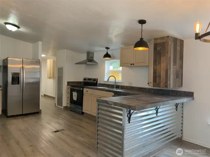Additional view of the kitchen.