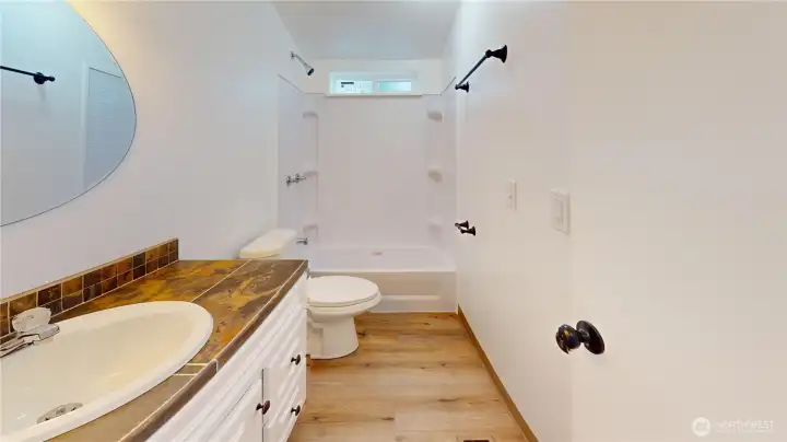 The main bath is conviently located off the great room with easy access from the second and third bedroom.