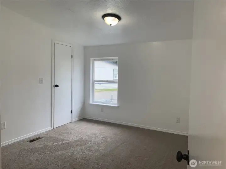 Both the second and third bedrooms offer walk-in closets and new carpeting.