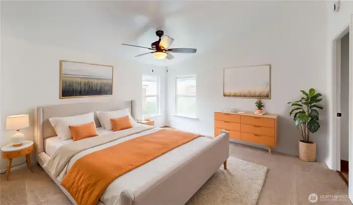 Virtually staged view of the primary suite.