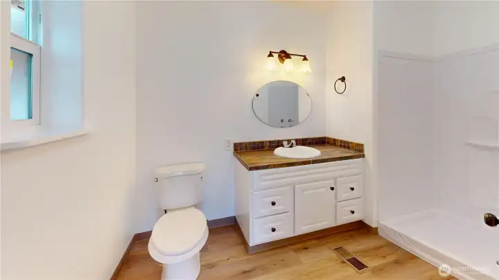 Completely updated primary bathroom with large shower!