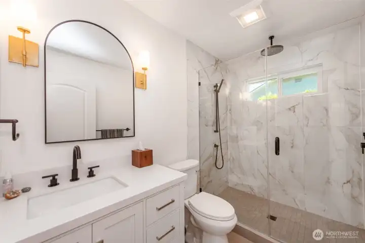 remodeled primary bath with walk in shower
