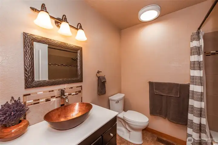 main bathroom with tub and shower