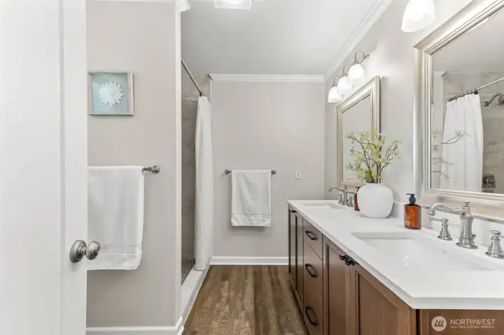 Newly updated ensuite bath with double vanities and quartz counters