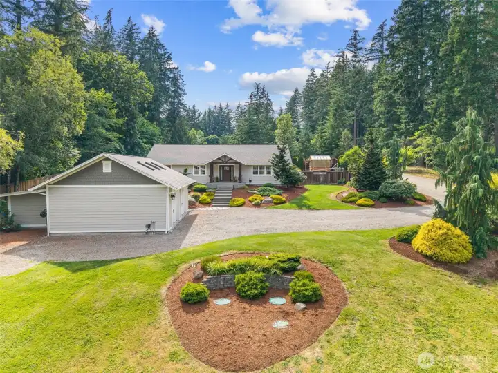 The front is just as detailed as the back. Beautifully landscaped across the entire property!