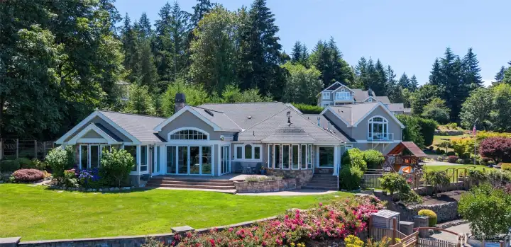 This water-view estate offers a rare blend of luxury, privacy and timeless NW beauty