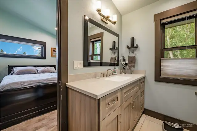 Connecting ensuite features programmable heated tile floors.
