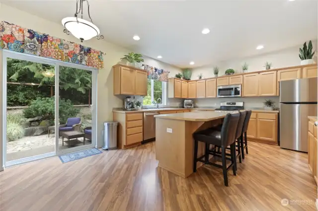 Well-appointed kitchen has easy connection to the outdoor patio as well as space to add a kitchen dining table too.