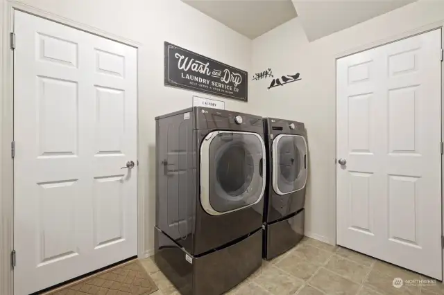 Utility room back on the main floor serves as a mud room buffer between the garage and home too! Don't miss the huge understair storage area found there as well.