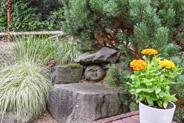 Yard is well hardscaped with sweet touches and filled with hardy, drought tolerant plantings.