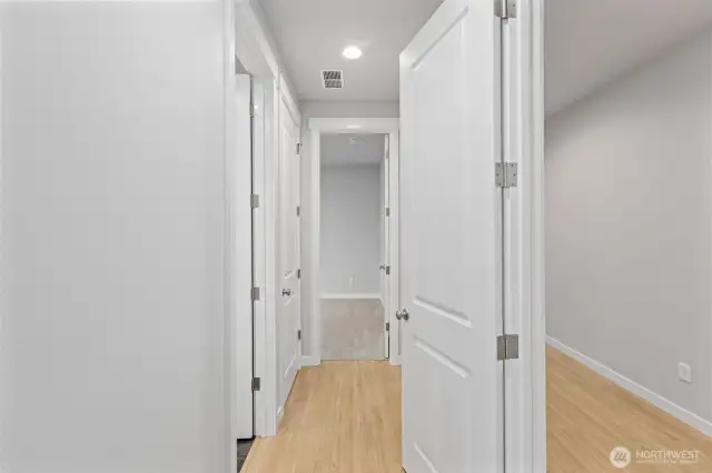 Multi-Gen hallway to Bedroom, Bath, & Stack Laundry Room