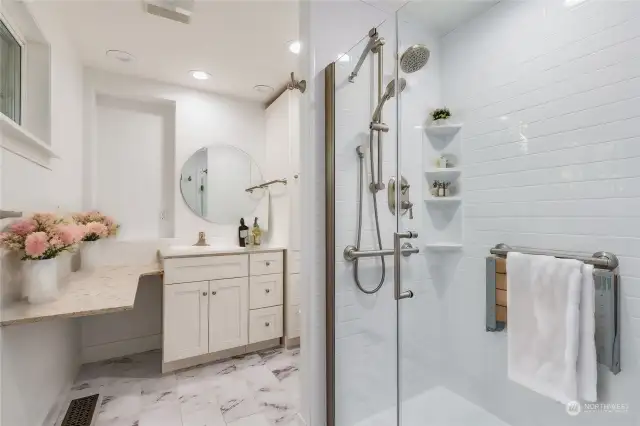 En-suite bathroom with granite vanity and installed heated bidet.