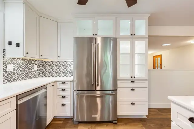 Beautiful cabinetry with backlit cabinets.