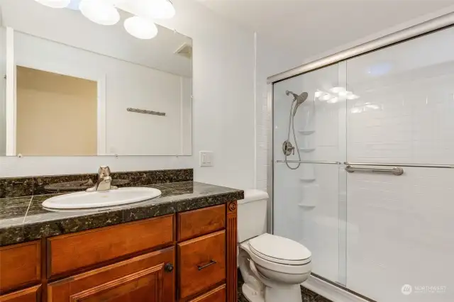 Main bathroom upstairs with laundry chute.